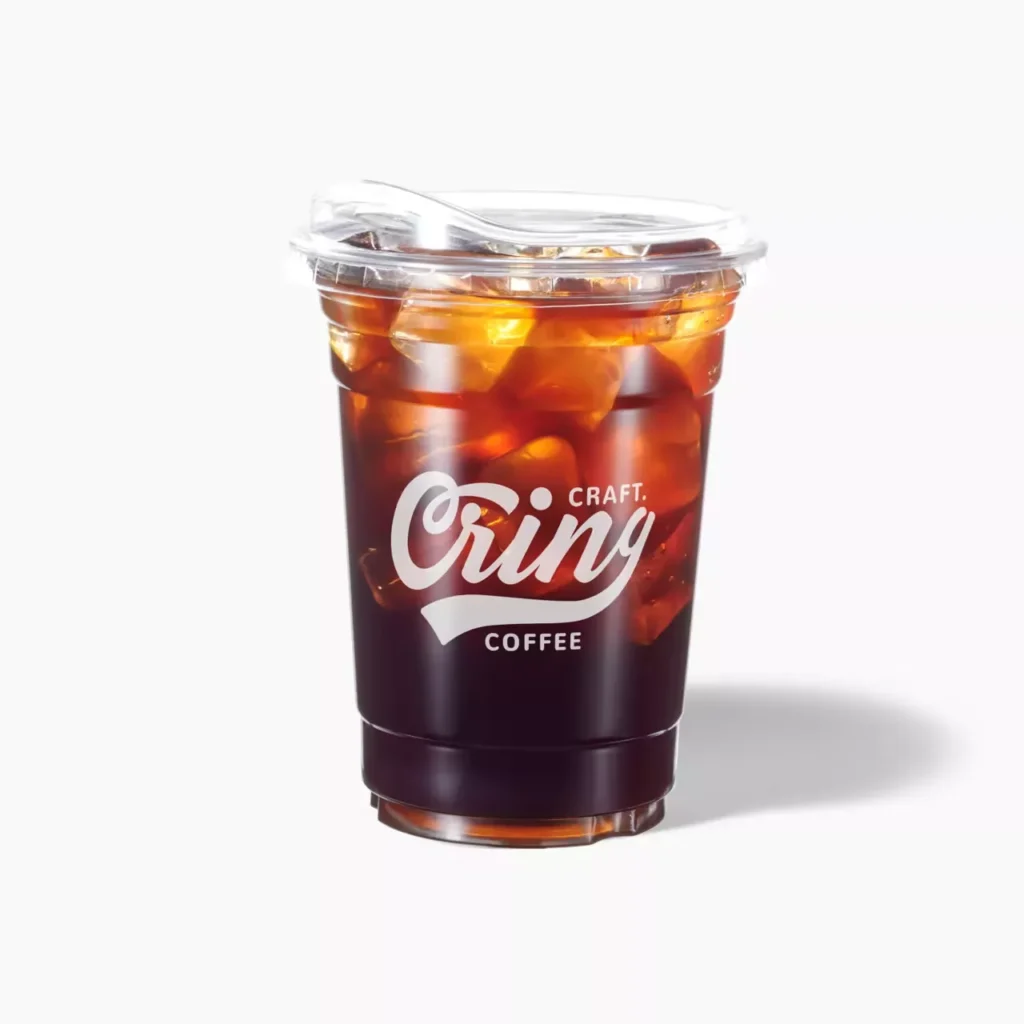 Bulk cup storage of clear plastic iced coffee cups with "Cring Craft Coffee" logo