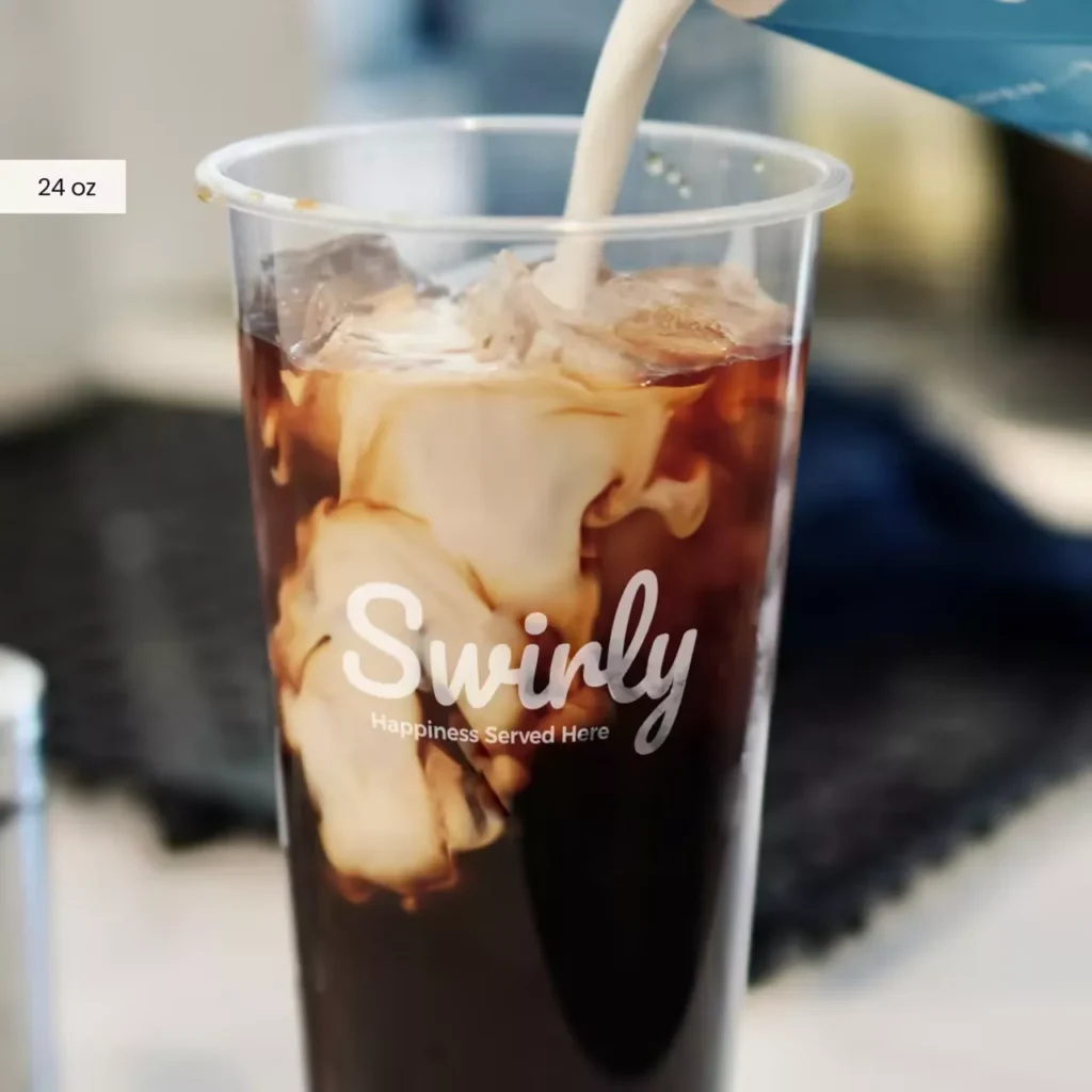 24oz tall bubble tea cups for delivery - clear plastic takeout cups for iced coffee and bubble tea, showing milk pouring into the drink