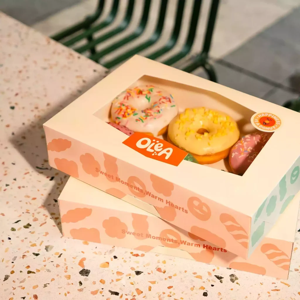 Pastel custom window donut box with brand artwork, custom donut box guide custom printed packaging