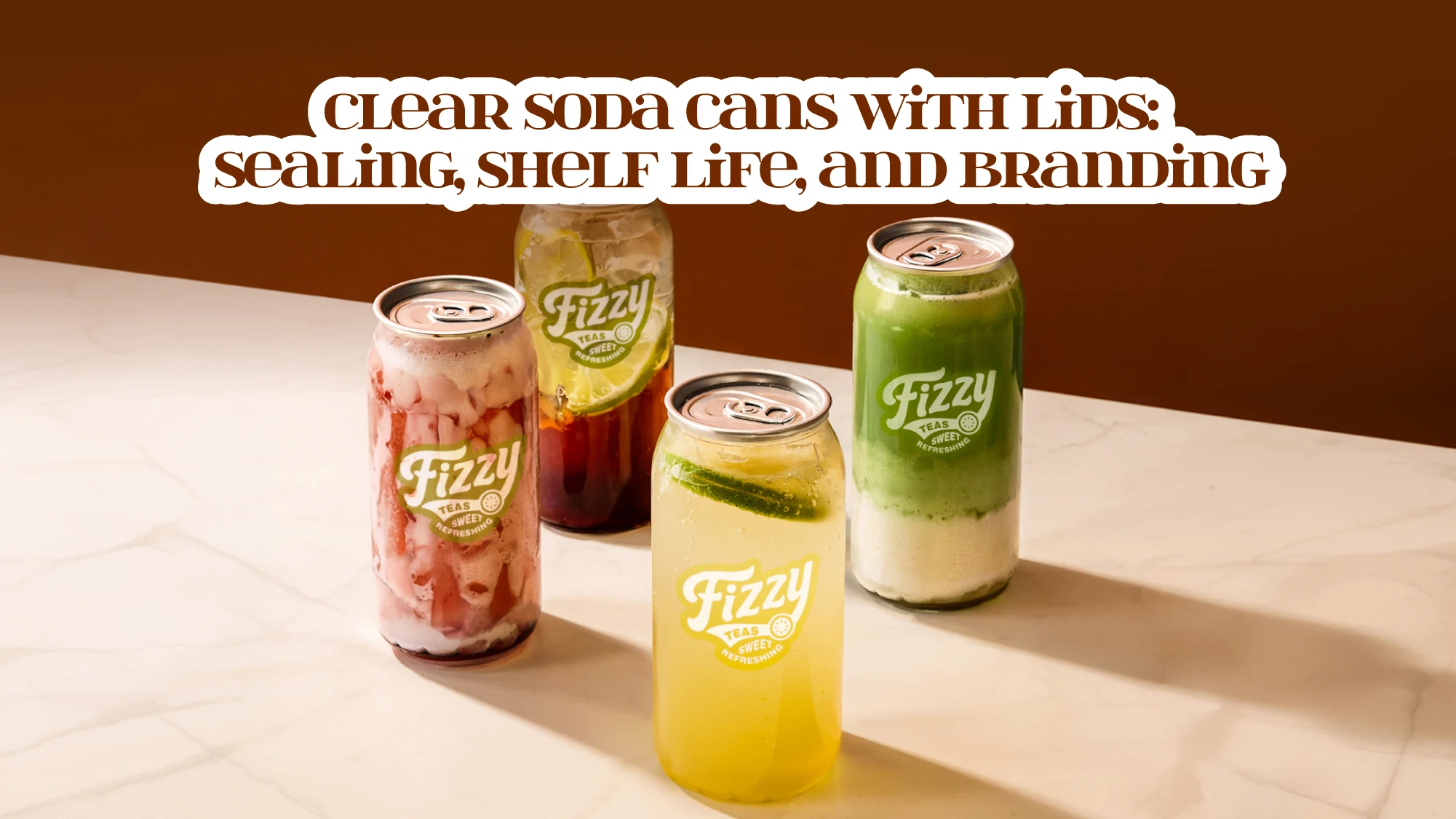 Four clear soda cans with aluminum lids holding coloured teas and sparkling drinks, contents visible through the body